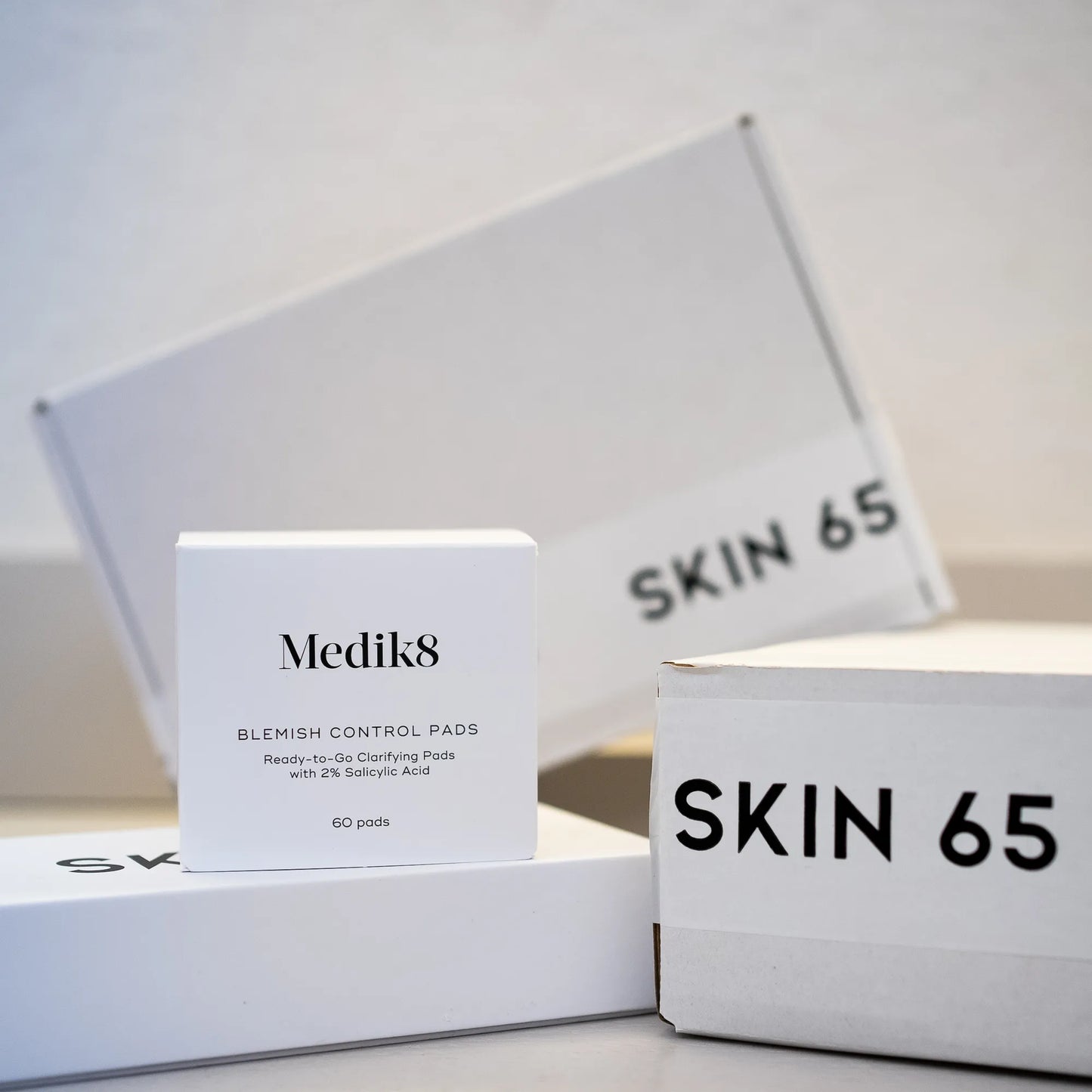 Medik8 Blemish Control Pads At Skin 65 in the Box with Skin 65 Branding in the Background