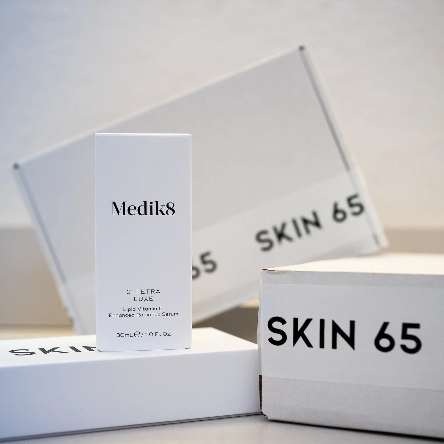 Medik8 C-Tetra Luxe 30ml in Box with Skin65 Branding in the Background