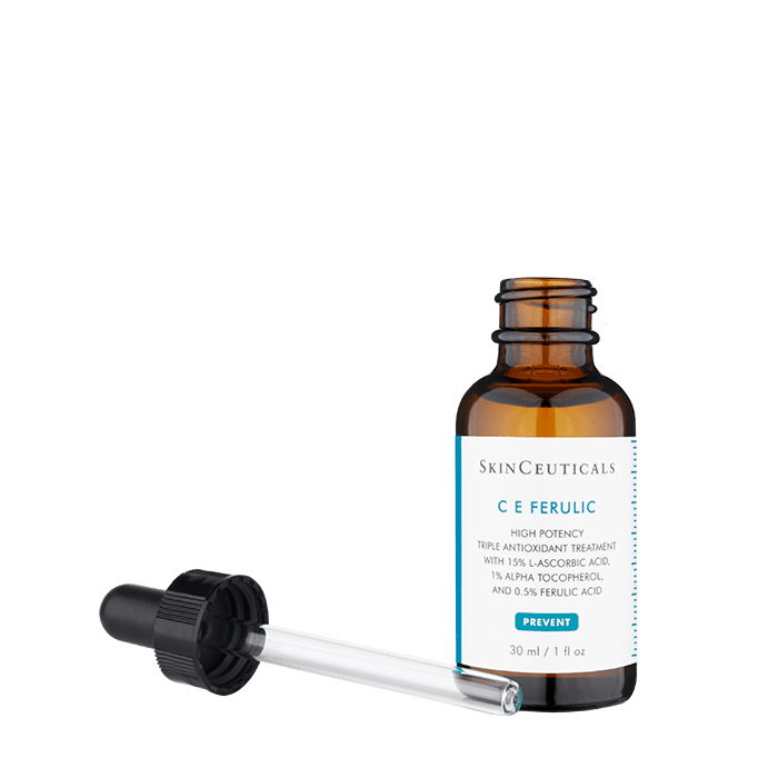 A brown glass dropper bottle labeled "SkinCeuticals CE Ferulic" sits against a white background. The detached dropper lies in front. The text reads:
"SkinCeuticals
C E Ferulic
High potency triple antioxidant treatment with 15% L-ascorbic acid, 1% alpha-tocopherol, and 0.5% ferulic acid.
PREVENT
30 ml / 1 fl oz"