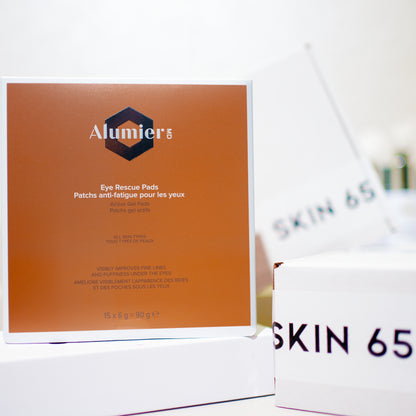 Alumier MD Eye Rescue Pads With Skin65 Branding in the Background