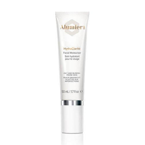 A white tube labeled "AlumierMD HydraClarité Facial Moisturizer" with silver cap, standing upright, containing 50 mL (1.7 fl oz). Text indicates it's for oily and blemish-prone skin.