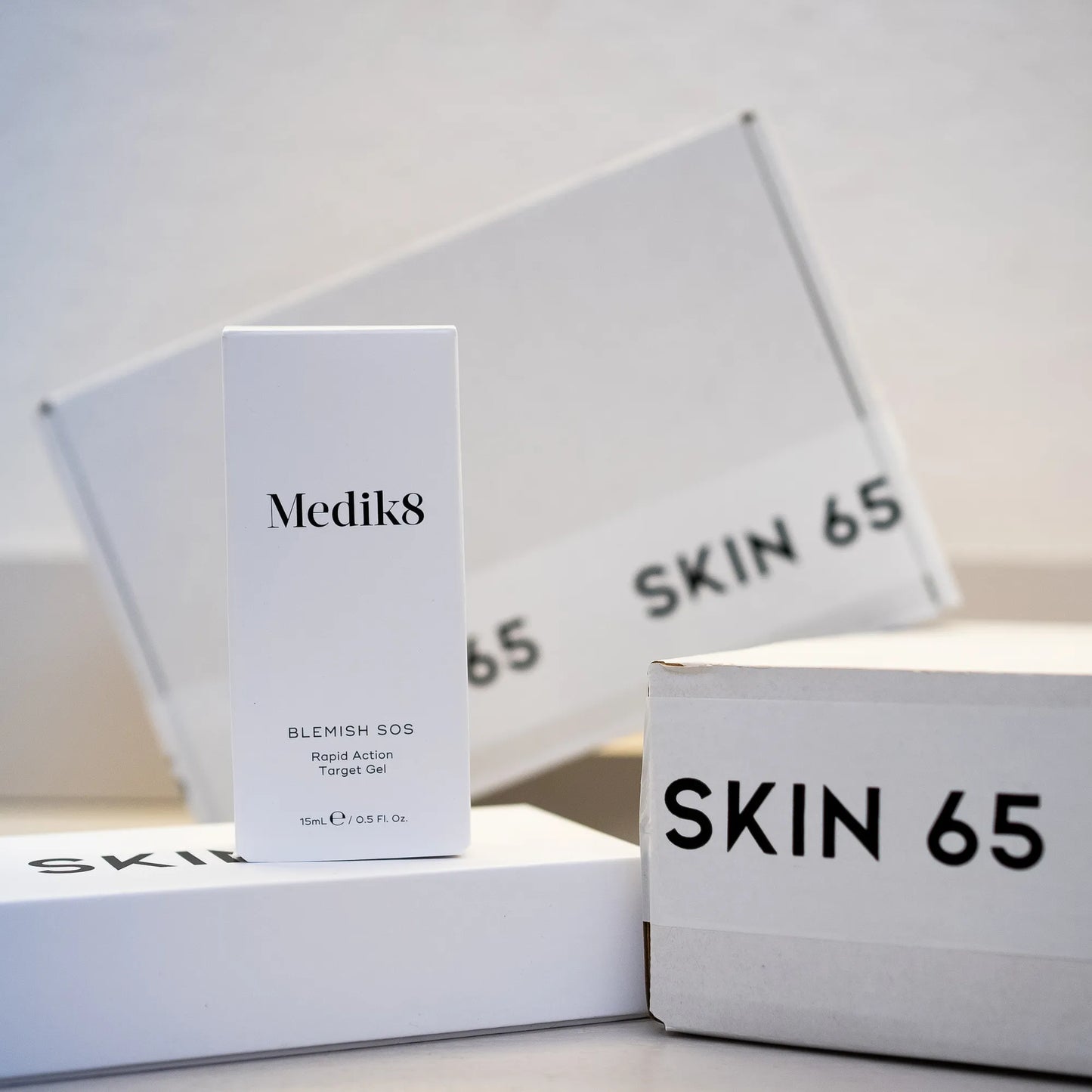 Blemish SOS by Medik8 in box with kin 65 Branding in the Background