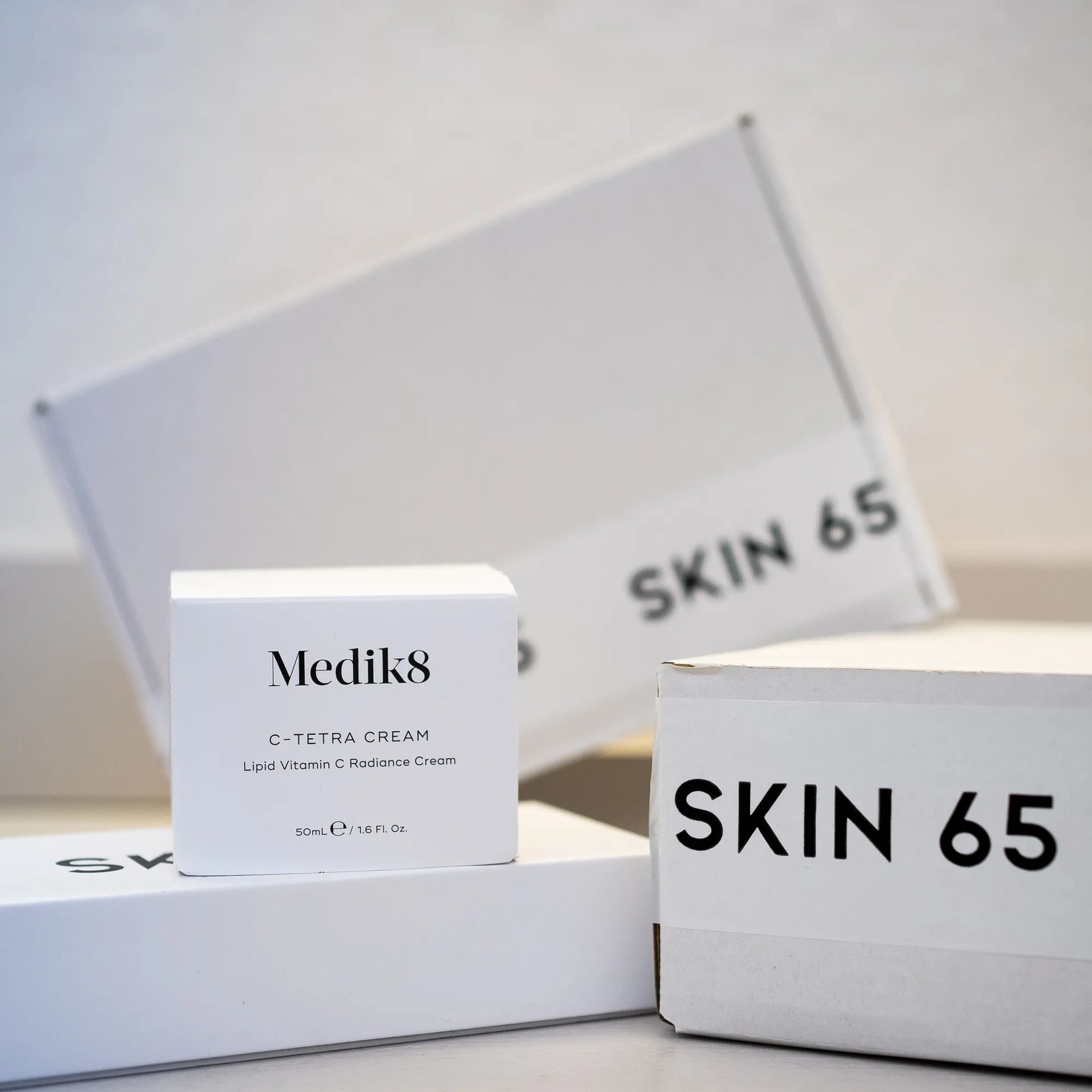 C-Tetra Cream in The Box with Skin65 Branding in the Background