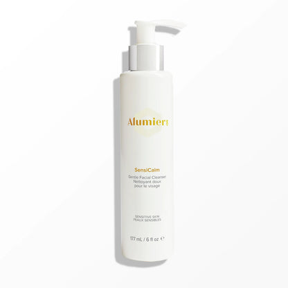 A white pump bottle labeled "Alumier SensiCalm Gentle Facial Cleanser" for sensitive skin stands on a plain light gray background. Additional text: "177 mL / 6 fl oz."