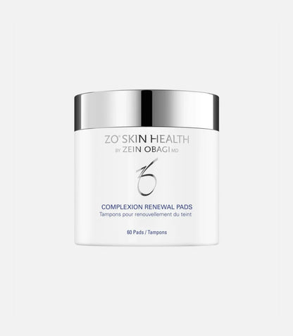 A white container with a shiny silver lid displays the text "ZO® SKIN HEALTH BY ZEIN OBAGI MD COMPLEXION RENEWAL PADS Tampons pour renouvellement du teint 60 Pads/Tampons." The background is plain light gray.