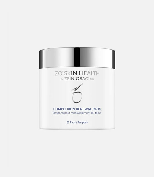 A white container with a shiny silver lid displays the text "ZO® SKIN HEALTH BY ZEIN OBAGI MD COMPLEXION RENEWAL PADS Tampons pour renouvellement du teint 60 Pads/Tampons." The background is plain light gray.