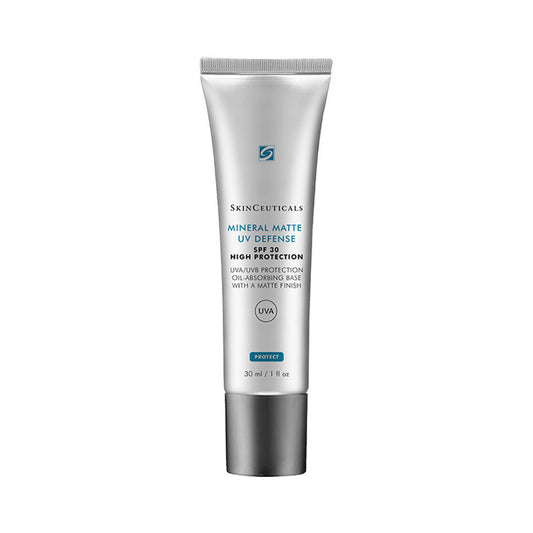 A silver tube labeled "SkinCeuticals Mineral Matte UV Defense SPF 30" stands upright against a white background, with text detailing high UVA/UVB protection and oil-absorbing matte finish; contains 30 ml.