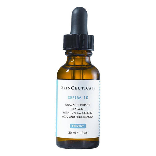 An amber glass bottle with a black dropper cap contains SkinCeuticals Serum 10, a dual antioxidant treatment with 10% L-ascorbic acid and ferulic acid, labeled "Prevent," 30 ml / 1 fl oz.