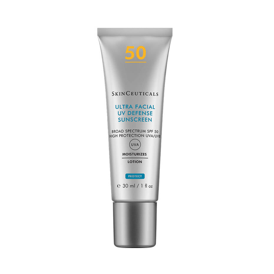 A silver tube labeled "SkinCeuticals Ultra Facial Defense Sunscreen SPF 50" stands upright against a white background. The text highlights, "Broad Spectrum SPF 50, UVA/UVB Protection, 30 ml / 1 fl oz."