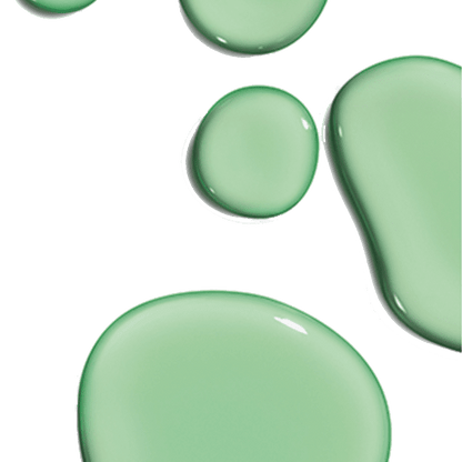 Green liquid droplets of varying sizes sit against a white background, appearing smooth and reflective. The context suggests a close-up view, highlighting their glossy texture.